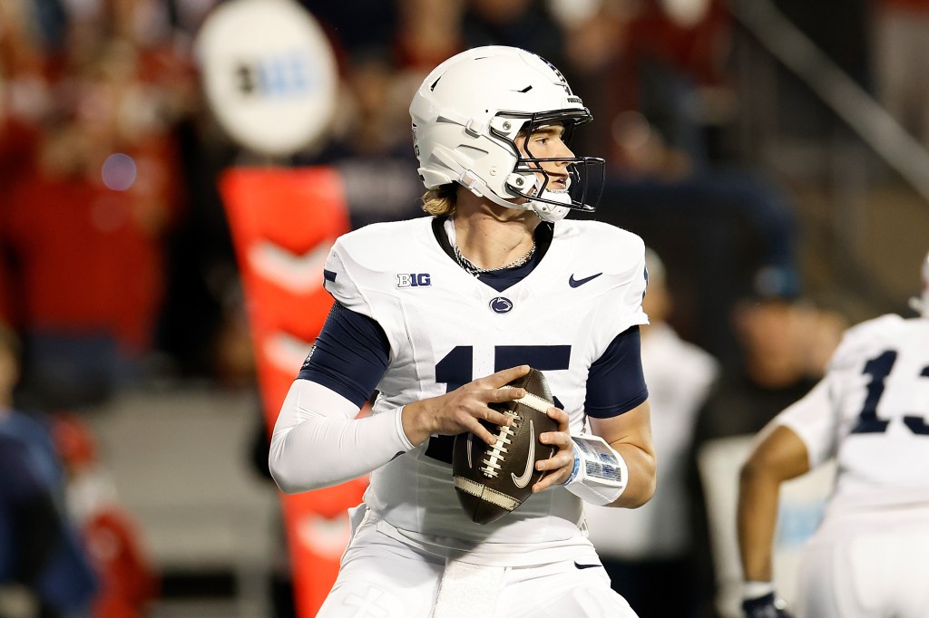 Drew Allar #15 of the Penn State Nittany Lions drops back to pass in the first quarter against the Wisconsin Badgers at Camp Randall Stadium on October 26, 2024 in Madison, Wisconsin. 