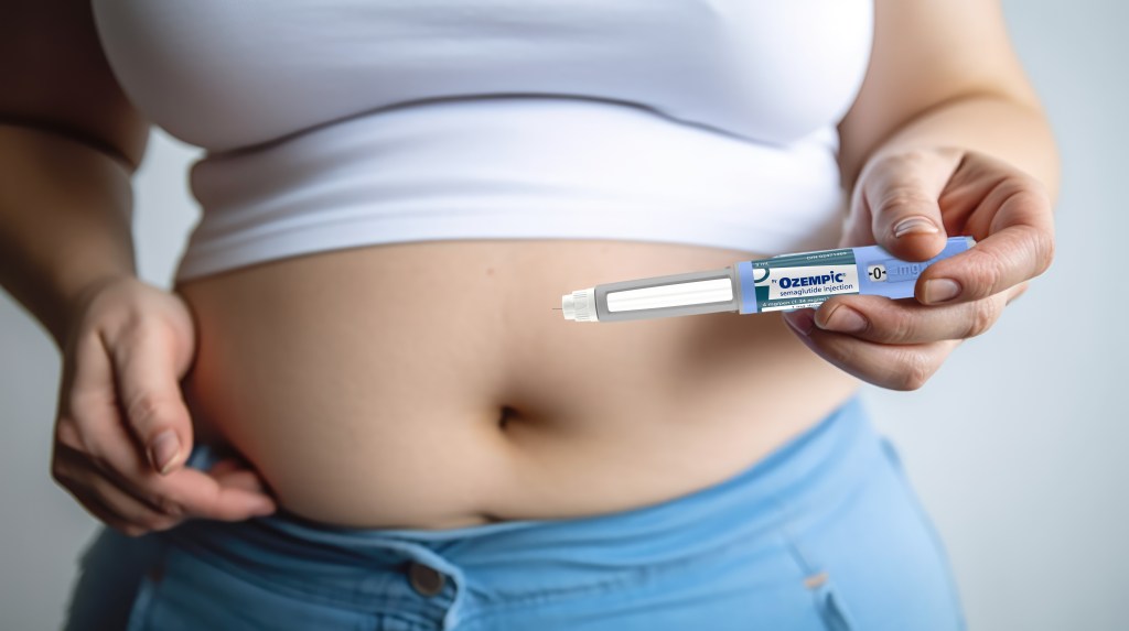 Woman holding an Ozempic semaglutide injection pen for diabetes and weight loss near her stomach