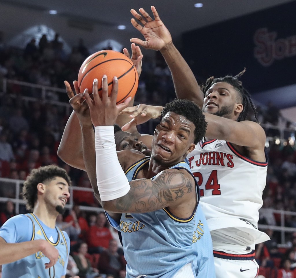 Amarri Monroe grabs a rebound in front of Zuby Ejiofor during St. John's 96-73 win over Quinnipiac on Nov. 9, 2024.