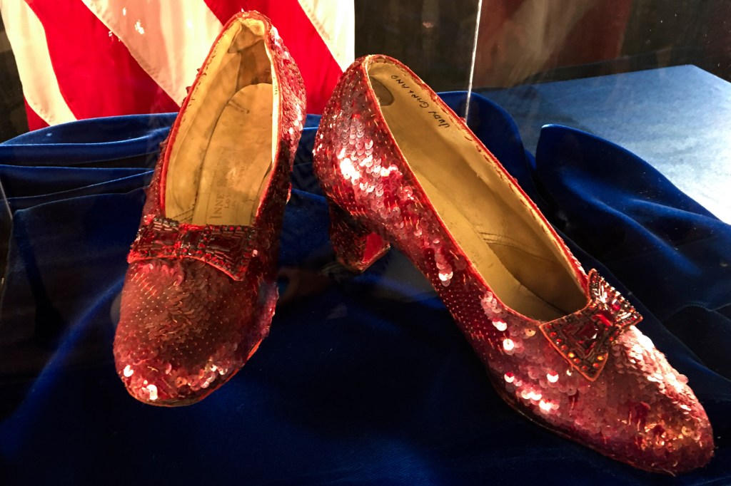 A pair of ruby slippers once worn by actress Judy Garland in the "The Wizard of Oz" sit on display at a news conference on Sept. 4, 2018, at the FBI office in Brooklyn Center, Minn.