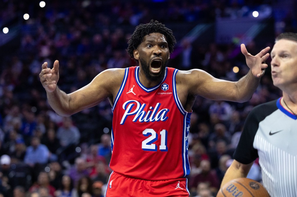 Philadelphia 76ers center Joel Embiid (21) reacts to a play against the New York Knicks during the third quarter at Wells Fargo Center. 