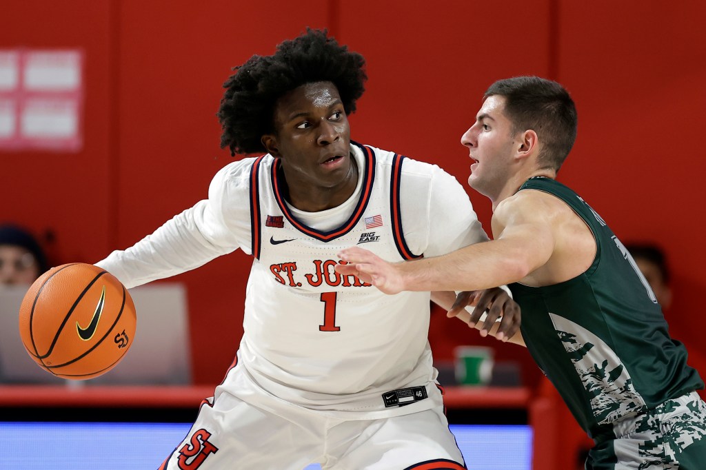 St. John's guard Kadary Richmond (1) looks to pass around Wagner guard Javier Ezquerra during the first half of an NCAA college basketball game Wednesday, Nov. 13, 2024, in New York.