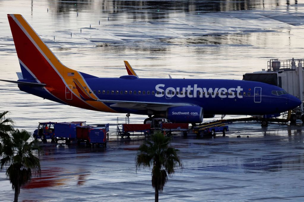 A Southwest Airlines jets sits at a gat at Orlando International Airport on Oct. 11, 2021.