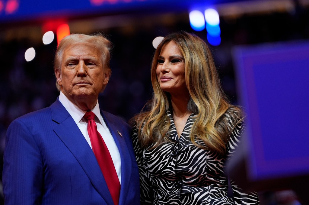 Republican presidential nominee former President Donald Trump and former first lady Melania Trump stand together on stage during a campaign rally at Madison Square Garden, Sunday, Oct. 27, 2024, in New York.