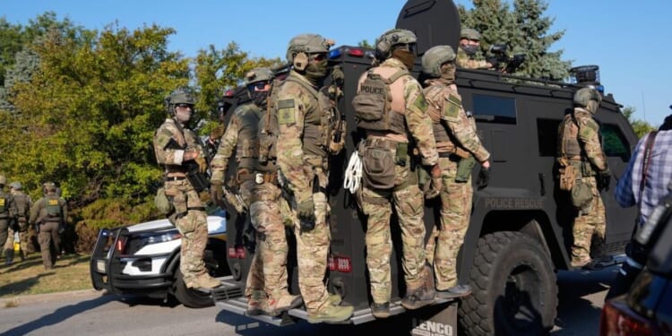 Woman shot after allegedly attempting to hit ICE agents with car