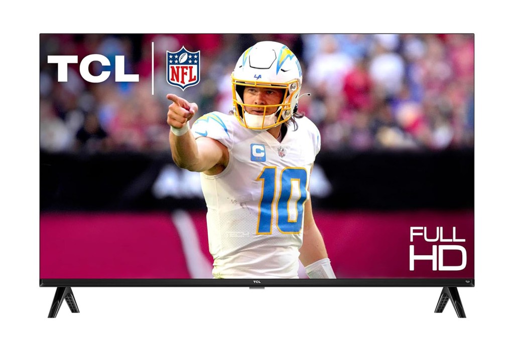 John Skelton, a man in a football uniform, pointing at something