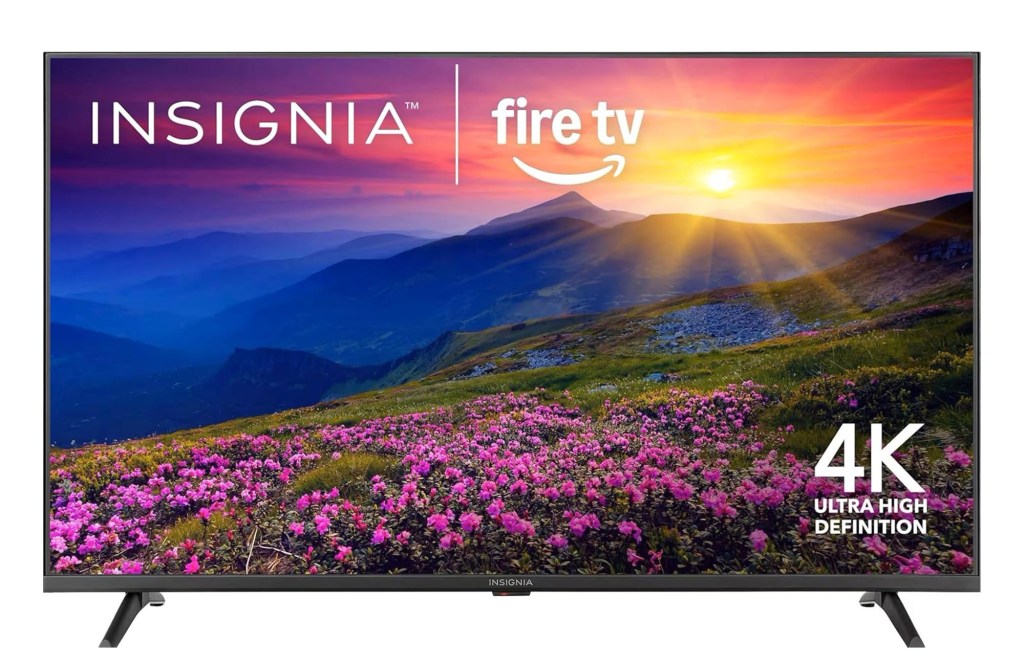 Insignia Fire TV with a scenic mountain sunset on screen and “4K Ultra High Definition” in the corner.