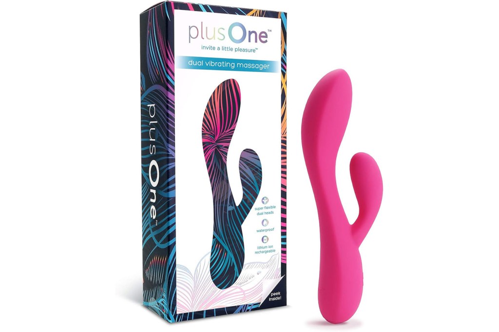 A pink toy rabbit next to a box