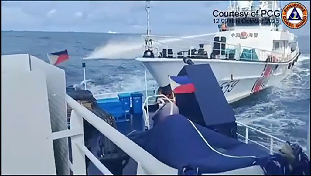 Chinese coast guard ship rammed and slightly damaged an anchored Philippine government vessel after unleashing its water cannons.