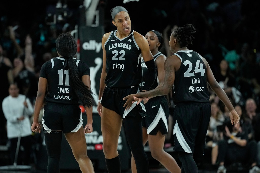 Las Vegas Aces center A'ja Wilson (22) celebrates with teammates.