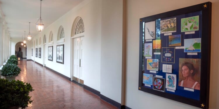 Artwork by military children decorates a display in the East Colonnade of the East Wing at the White House, Tuesday, Sept. 26, 2023, in Washington. First lady Jill Biden on Tuesday announced the Military Children's Corner at the White House, an installation that will feature art dedicated to America's military children. (AP Photo/Mark Schiefelbein)