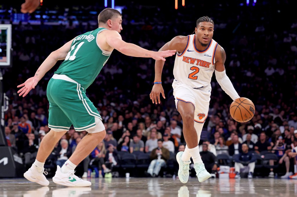 Miles McBride, who was placed in the starting lineup and scored 10 points, dribbles up court as Payton Pritchard defends during the Knicks' 105-95 win over the Celtics at the Garden on Oct. 24, 2025.