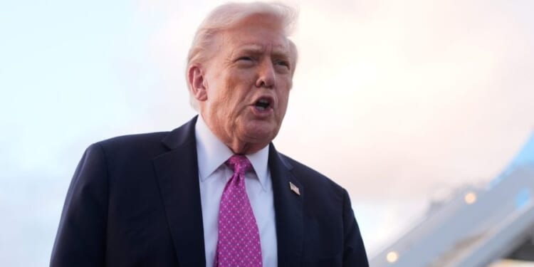 Trump signs order expanding auto tariff relief