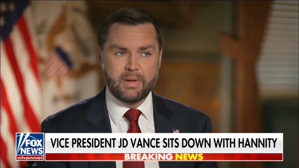 JD Vance on Fox News with text overlay "VICE PRESIDENT JD VANCE SITS DOWN WITH HANNITY" and "BREAKING NEWS".