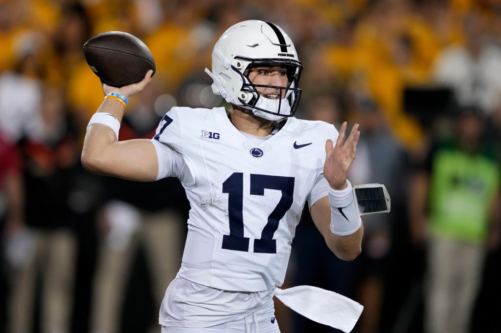 Penn State quarterback Ethan Grunkemeyer throwing a pass during an NCAA college football game against Iowa.