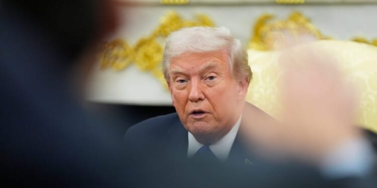 Trump says he won't attend Supreme Court arguments on tariff case