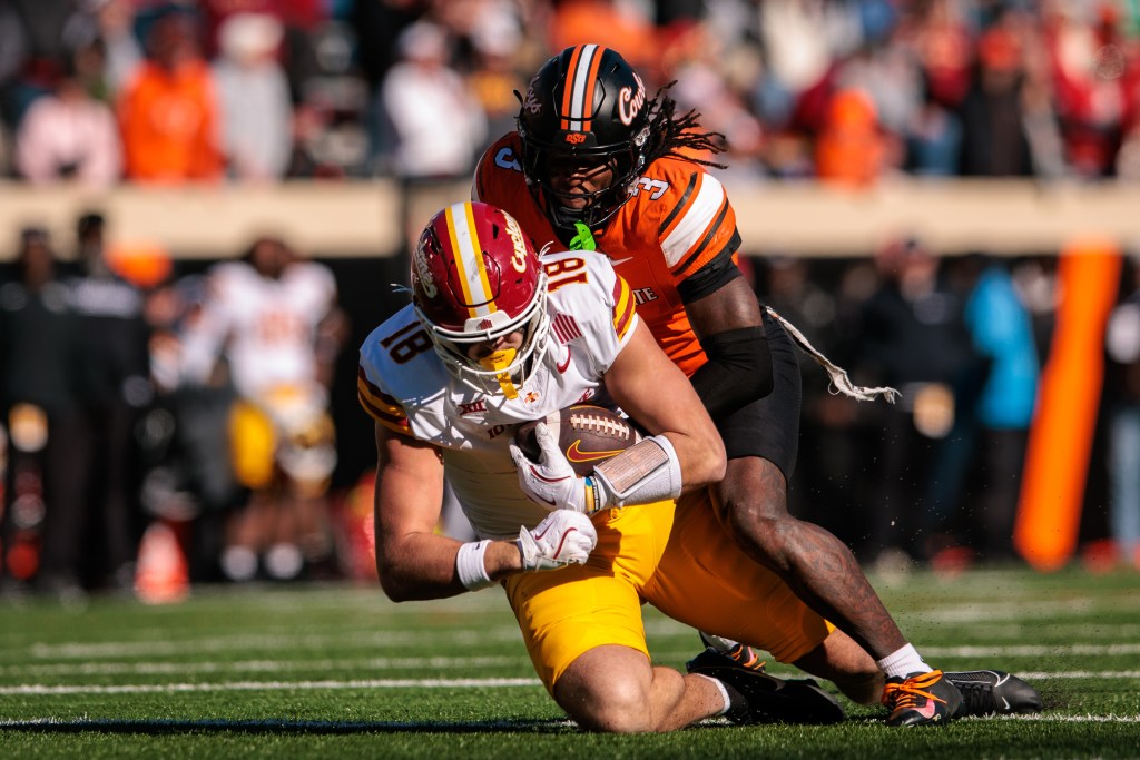 Iowa State wide receiver Karon Brookins (81) is tackled by Oklahoma State cornerback Cam Smith (3).