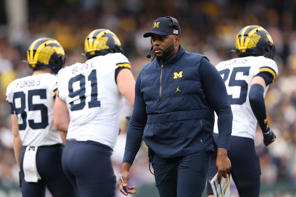 Head coach Sherrone Moore of the Michigan Wolverines looks on against the Northwestern Wildcats during the first half at Wrigley Field on November 15, 2025 in Chicago, Illinois.
