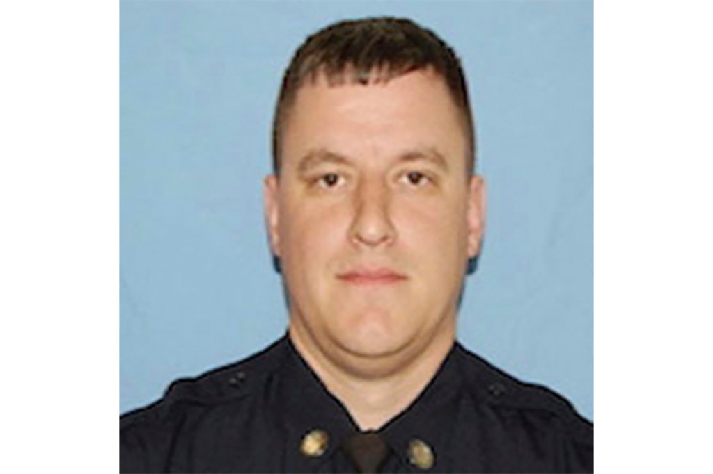 Headshot of Matthew Farwell, a former police officer, against a light blue background.