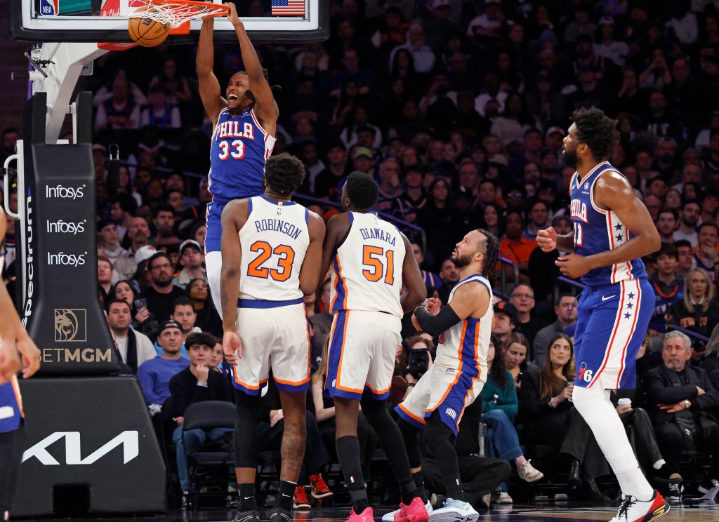 Jabari Walker slams the ball in front of New York Knicks center Mitchell Robinson, New York Knicks forward Mohamed Diawara, and New York Knicks guard Jalen Brunson in the second half at Madison Square Garden in Manhattan, New York, Saturday, January 03, 2026.