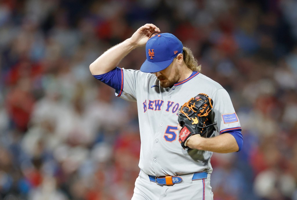 New York Mets pitcher Ryne Stanek reacts after allowing a sacrifice fly.