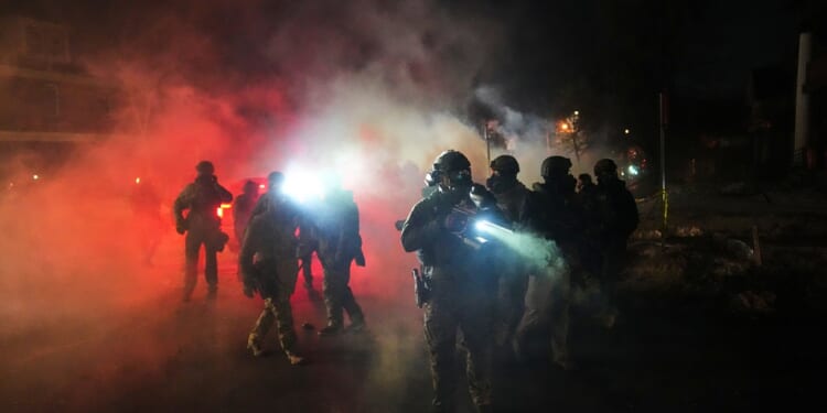 Tensions in Minneapolis rise as Trump threatens to invoke Insurrection Act