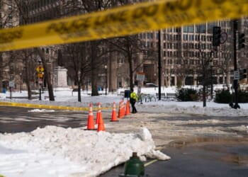 DC crews pile snow at RFK Stadium site as city slowly digs out of storm