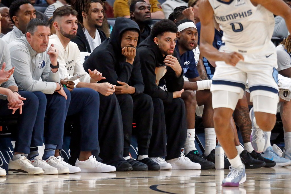 Memphis Grizzlies guard Ja Morant (12) looks on from the bench during the second quarter.