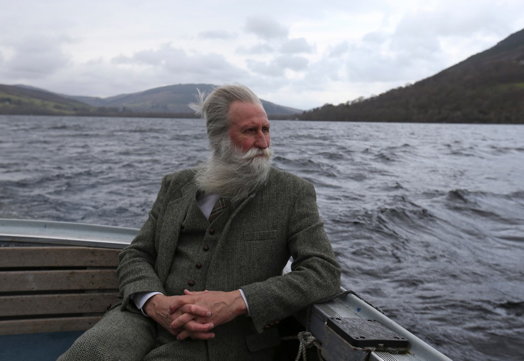 Adrian Shine, leader of the Loch Ness Project, on a boat in Loch Ness, Scotland.
