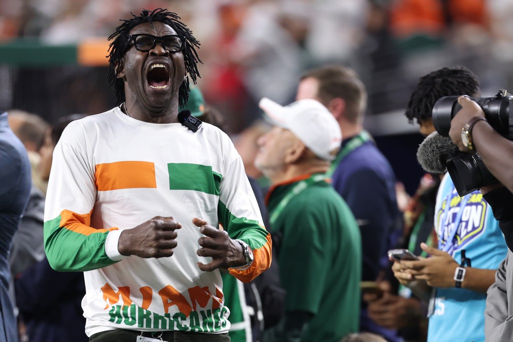 Former Miami Hurricanes wide receiver Michael Irvin celebrates during a college football game.