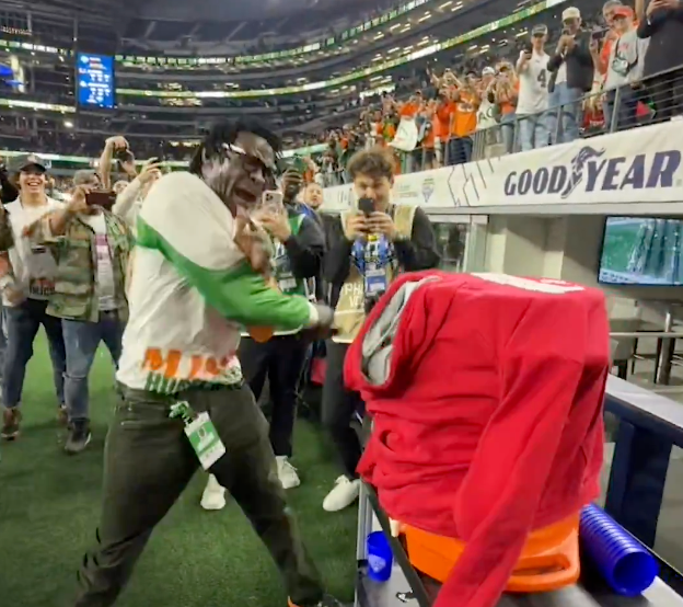 Michael Irvin whips a water cooler Wednesday night.
