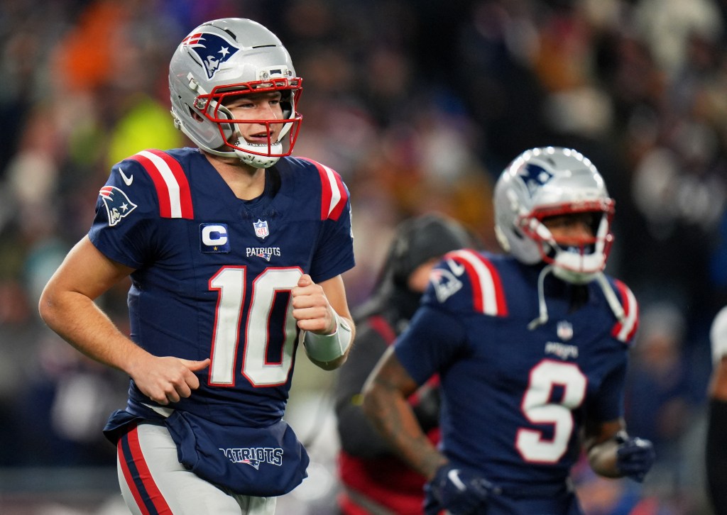 New England Patriots quarterback Drake Maye (10) and wide receiver Kayshon Boutte (9) run off the field after a Patriots touchdown.