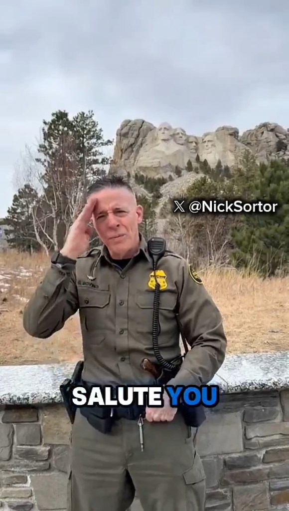 Greg Bovino, Border Patrol chief, saluting with Mount Rushmore in the background.