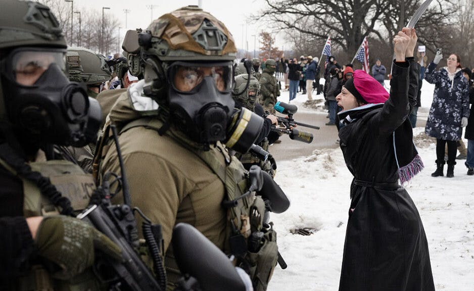 MINNEAPOLIS, MINNESOTA - JANUARY 08: (EDITOR'S NOTE: Alternate crop) Demonstrators confront federal agents outside the Whipple federal building on January 08, 2026 in Minneapolis, Minnesota. Yesterday, a federal agent allegedly fatally shot a woman in her car during an incident in south Minneapolis. (Photo by Scott Olson/Getty Images)