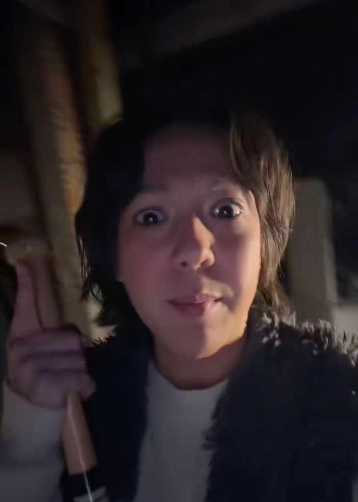 Woman looking into camera.