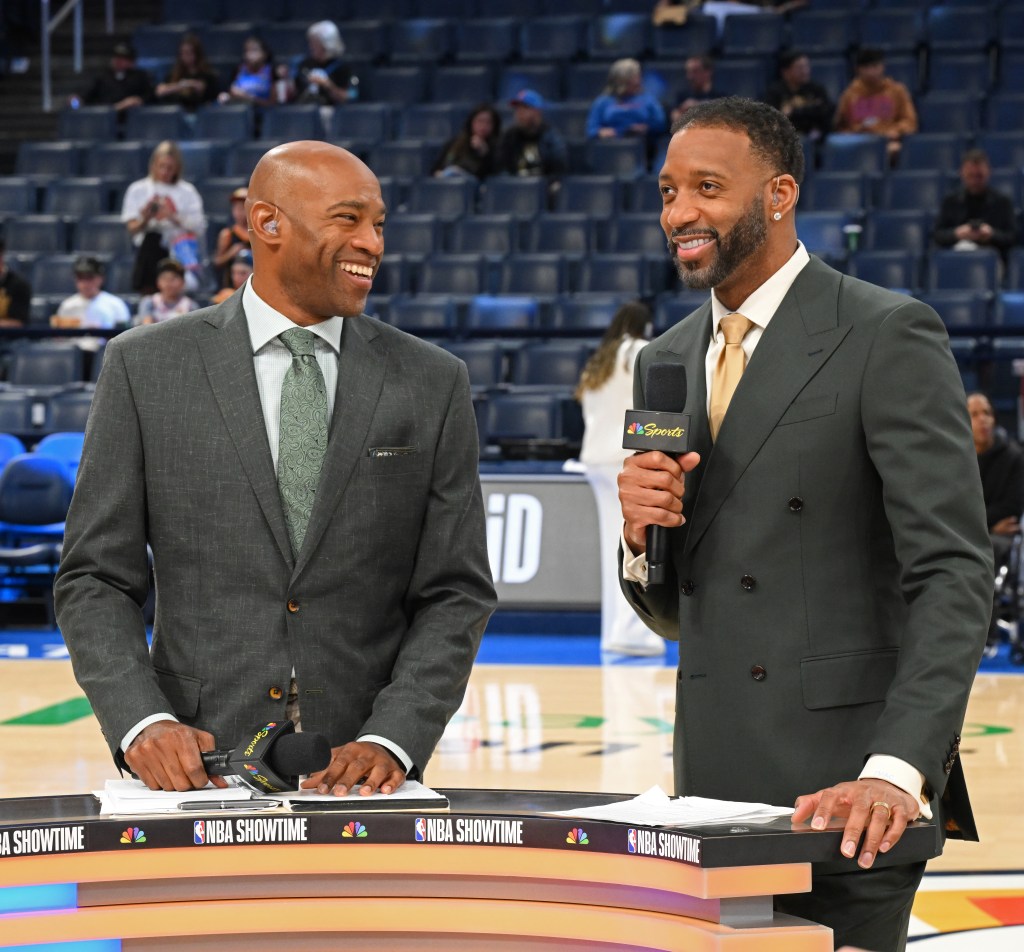 Vince Carter and Tracy McGrady commentating a basketball game.