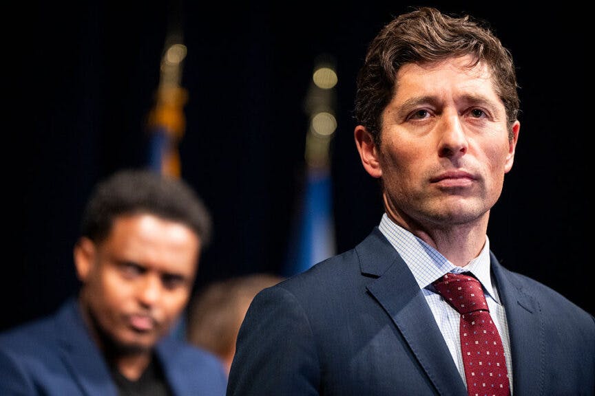 MINNEAPOLIS, MN. - DECEMBER 2025: Minneapolis Mayor Jacob Frey speaks during a press conference to address the media following reports that the Trump administration will be targeting Somali immigrants in the Twin Cities, held at City Hall in Minneapolis, Minn., on Tuesday, December 2, 2025. Behind Frey is Minneapolis city council member Jamal Osman.