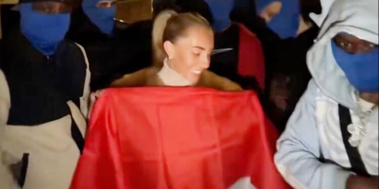 Porn star Bonnie Blue charged after mimicking sex act outside Indonesian embassy in UK