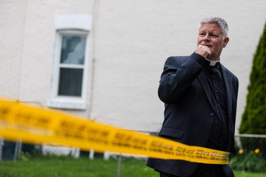 Toronto, ON - June 10: St. Anne's Reverend Don Beyers looks towards the remains of his church. Historic St. Anne's Anglican Church at 270 Gladstone Ave. was destroyed by a fire early on June 9th. (Photo by Nick Lachance/Toronto Star via Getty Images)