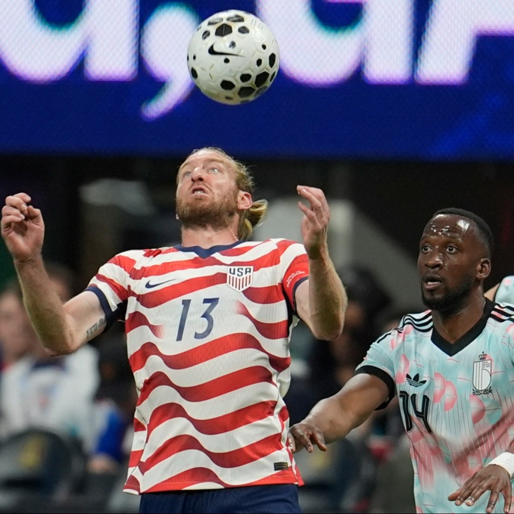 Tim Ream (13) tries the control the ball as Belgium's Dodi Lukebakio (14) looks on during the second half of an international friendly soccer match, Saturday, March 28, 2026, in Atlanta. 