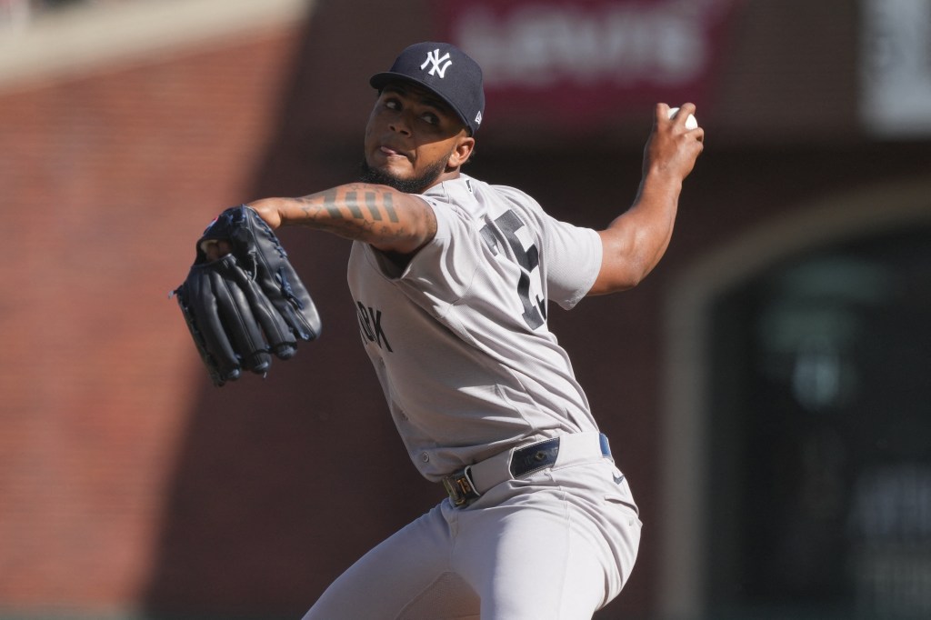New York Yankees pitcher Camilo Doval (75) throws a pitch against the San Francisco Giants during the eighth inning at Oracle Park.