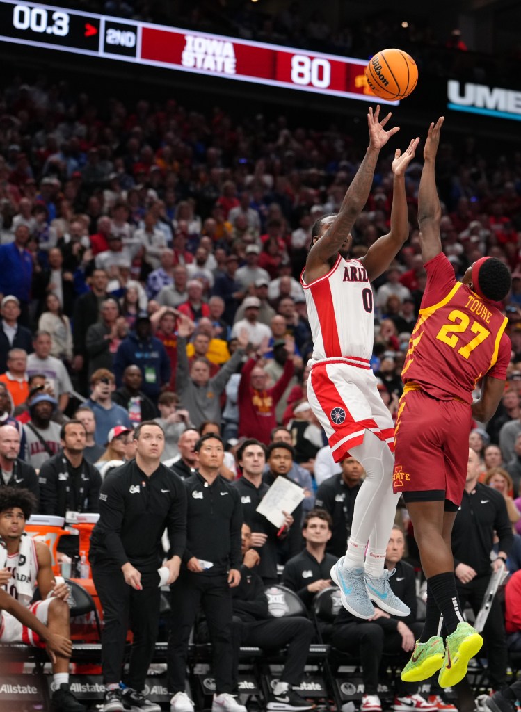 Jaden Bradley #0 of the Arizona Wildcats shoots the game-winning basket over Killyan Toure #27 of the Iowa State Cyclones in the second half during the semifinals of the Big 12 Tournament at T-Mobile Center on March 13, 2026 in Kansas City, Missouri.