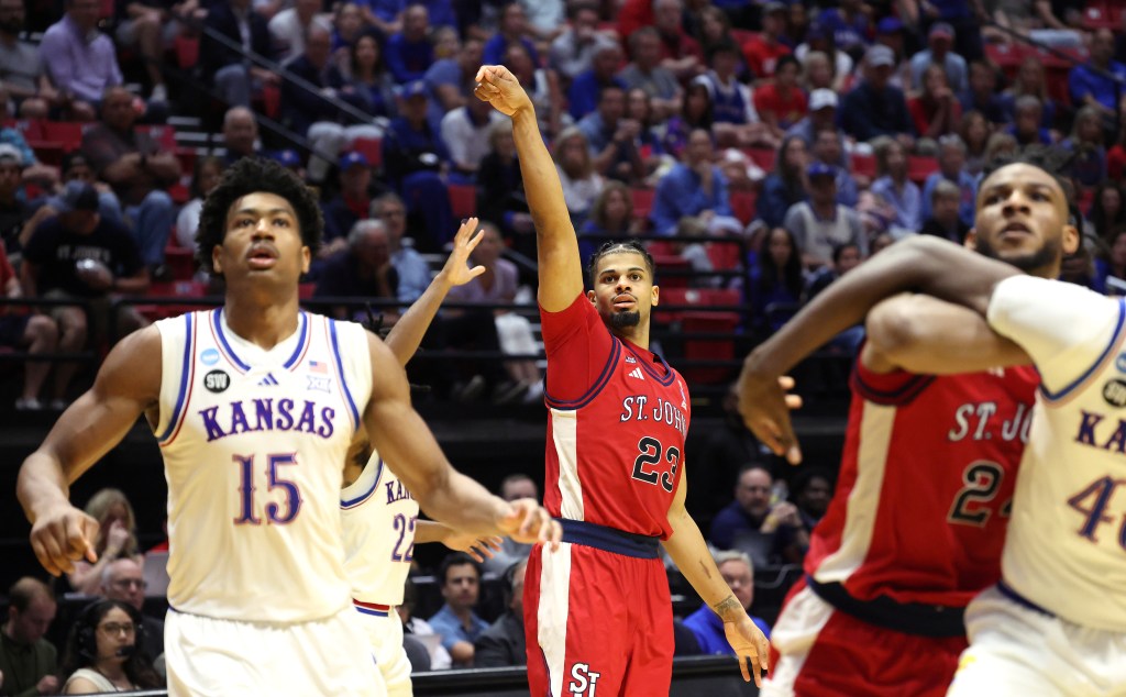 St. John's Red Storm forward Bryce Hopkins #23 shooting a jump shot during an NCAA Tournament game against the Kansas Jayhawks.