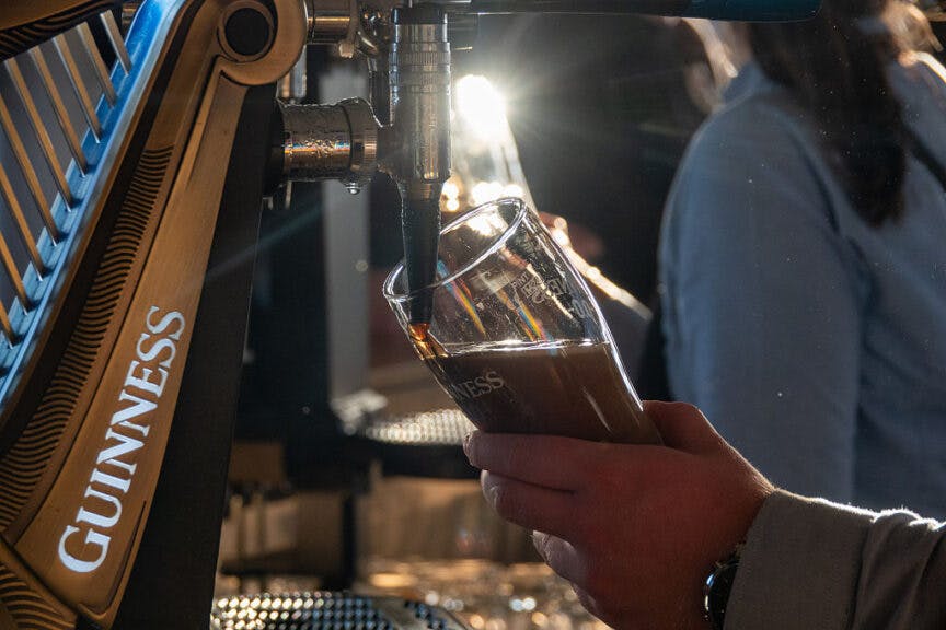 DUBLIN, IRELAND - OCTOBER 31: The sun shines on a pint of Guninness that is being poured as people enjoy a drink in a bar in the city centre on October 31, 2025 in Dublin, Ireland. The city of Dublin, the capital of the Republic of Ireland, is located on Ireland’s east coast at the mouth of the River Liffey and is a popular destination for domestic tourists and with international visitors. (Photo by Matt Cardy/Getty Images)