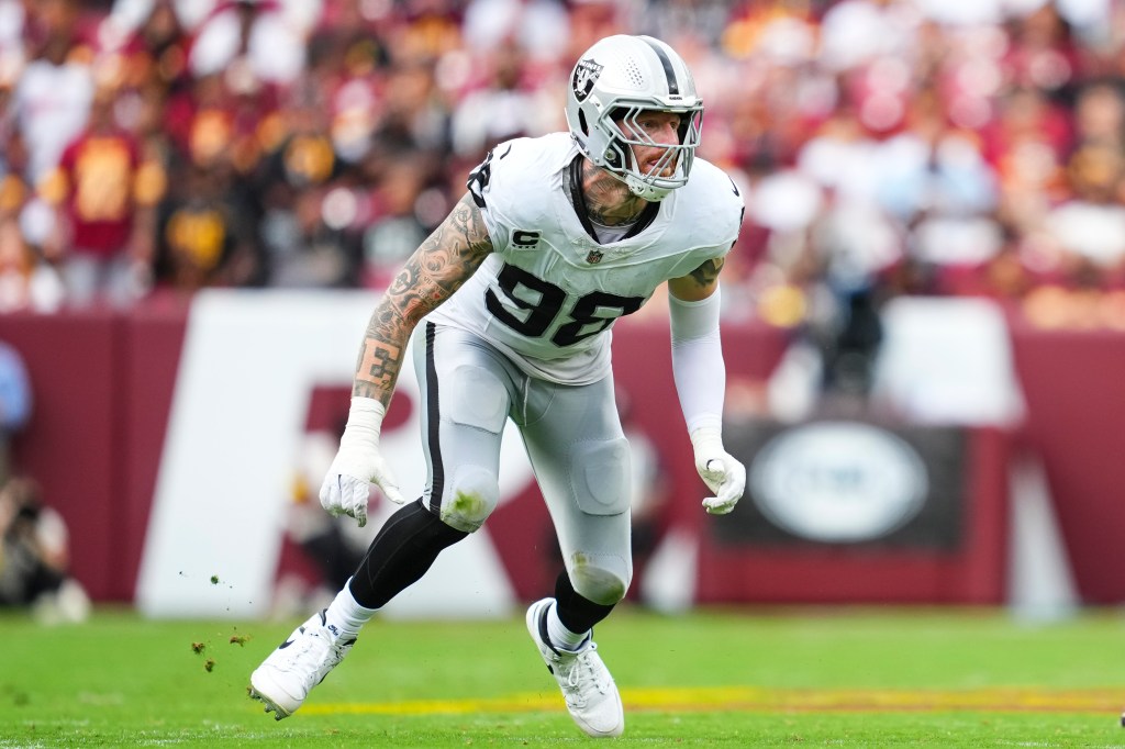 Maxx Crosby #98 of the Las Vegas Raiders rushes the passer during an NFL football game against the Washington Commanders at Northwest Stadium on September 21, 2025 in Landover, Maryland. 