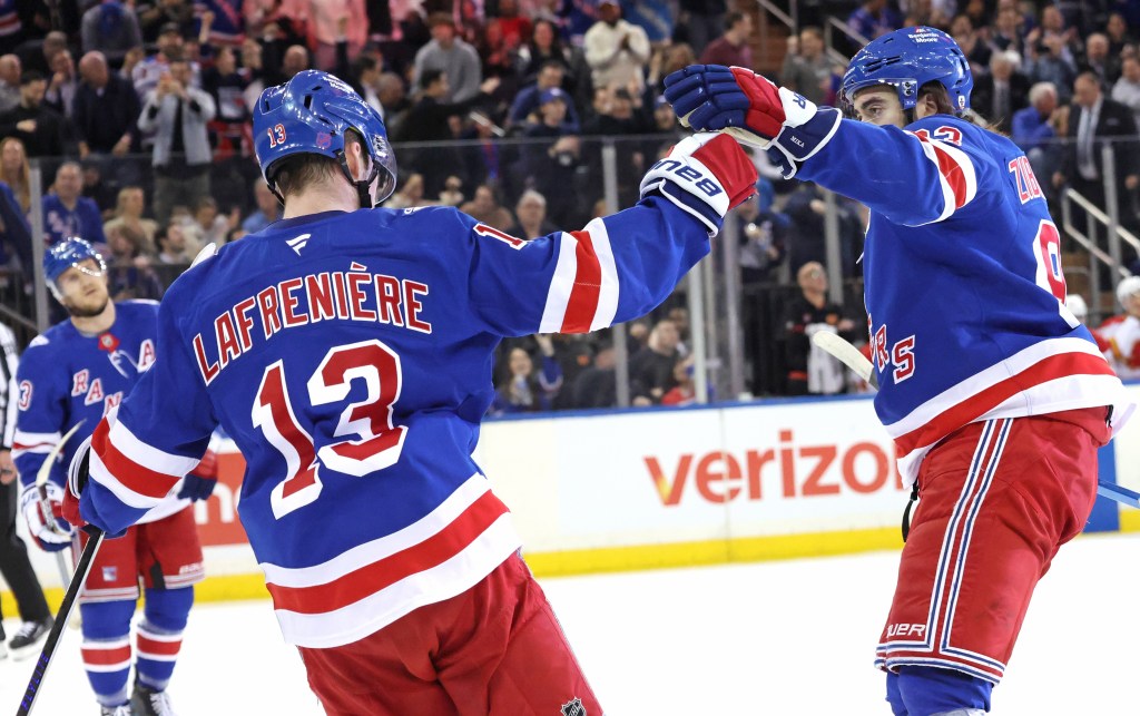 Mika Zibanejad (right) congratulates Alexis  Lafrenière after one of his three goals in the Rangers' 4-0 win over the Flames on March 10, 2026 at the Garden.