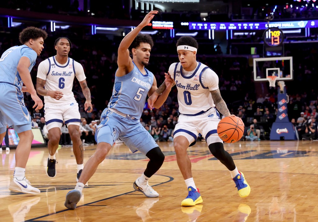 Adam Clark, who scored 16 points, drives on Nik Graves during Seton Hall's 72-61 win over Creighton in a Big East quarterfinal game on March 12, 2026 at the Garden.