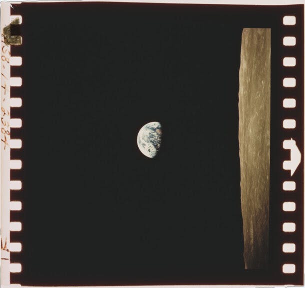 A view of the Earth beyond the lunar horizon, taken from the Apollo 8 spacecraft while in orbit around the Moon, by crewmember Bill Anders, 24th December 1968. (Photo by Space Frontiers/Getty Images)