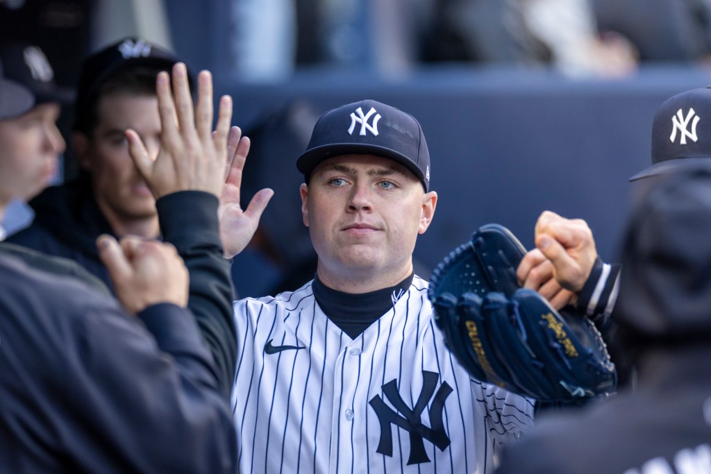 Yankees pitcher Ryan Weathers (40) is greeted by his teammates in the dugout after he is pulled from the game in the 8th inning at Yankee Stadium, Sunday, April 19, 2026, in Bronx, NY. 