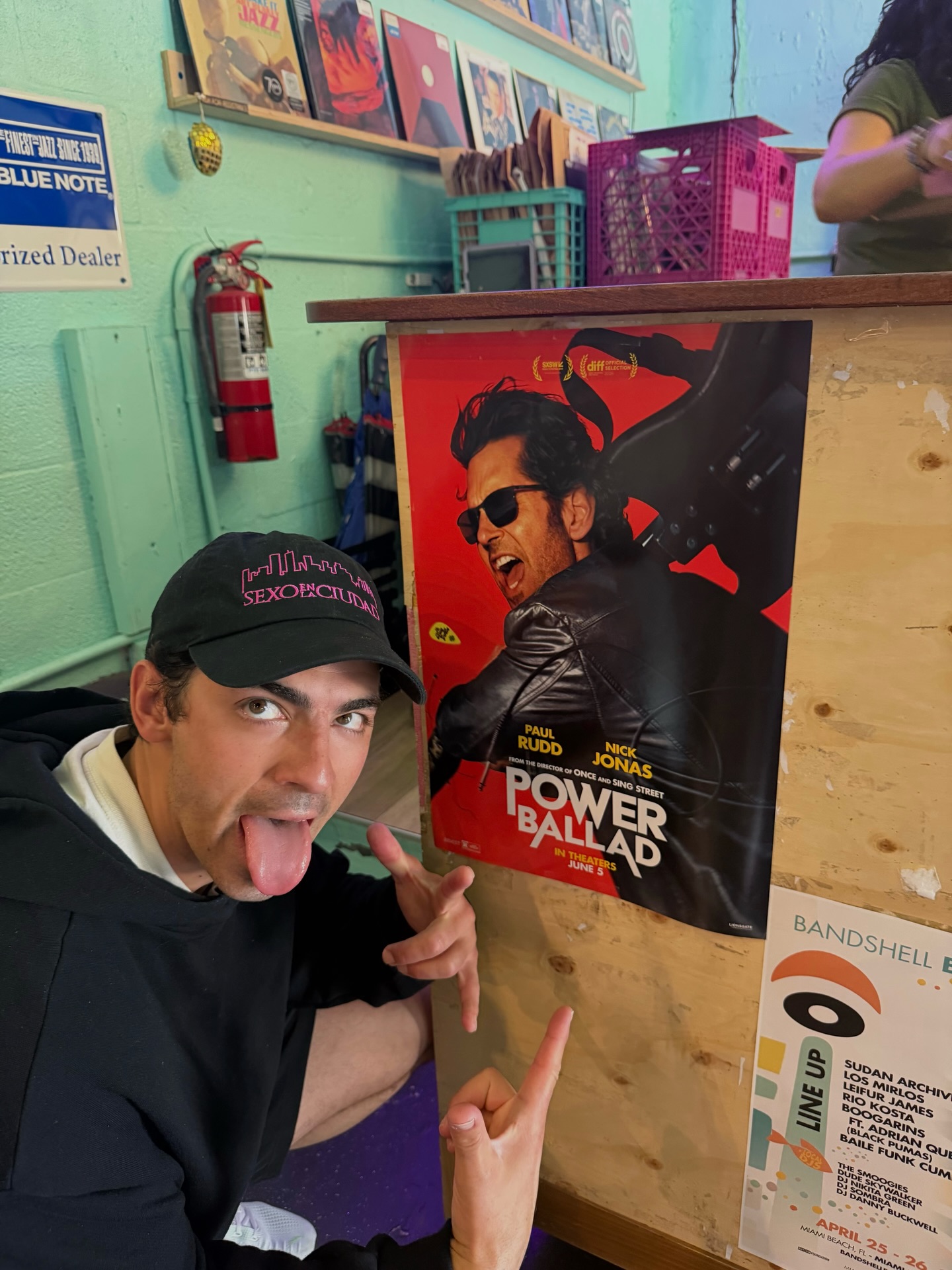 Joe Jonas poses with his 'Power Ballad' poster.